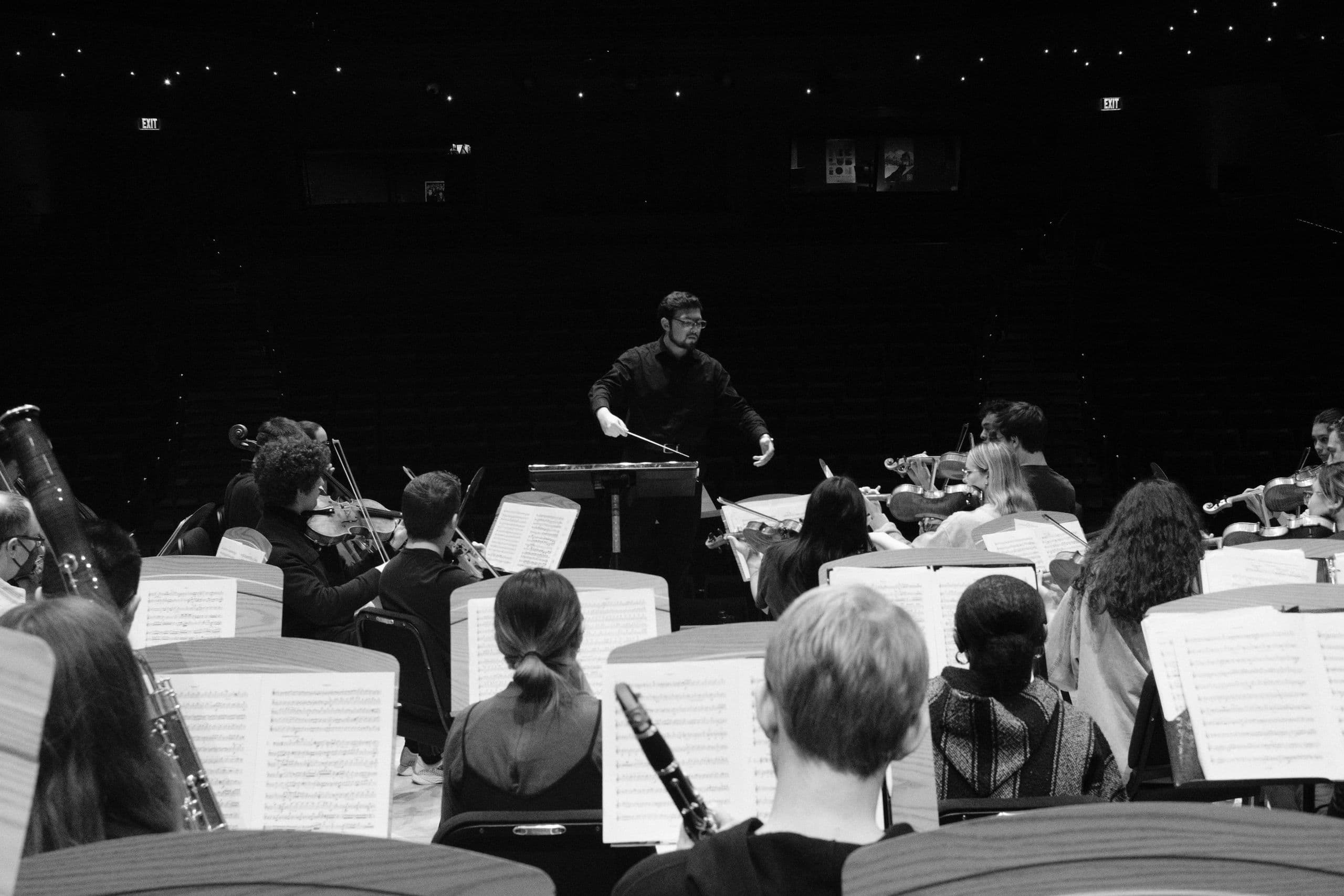 Andres Fierro conducting an orchestra rehearsal